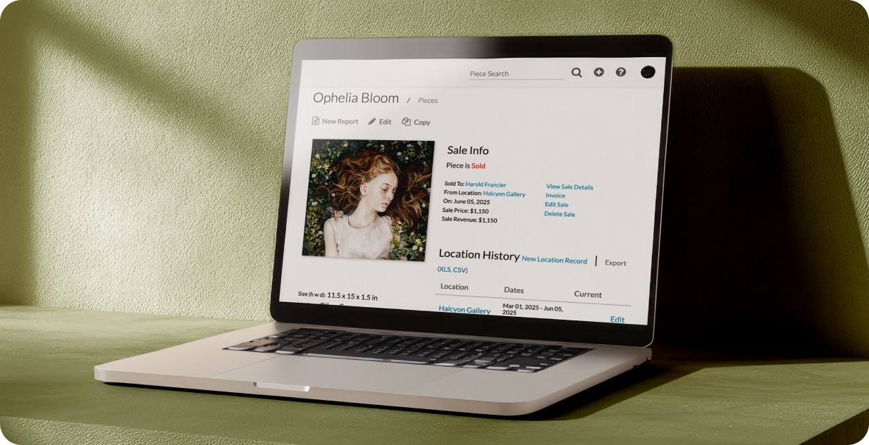 Laptop on desk displaying Artwork Archive collection management interface