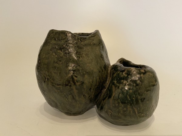 Two conjoined ceramic ikebana vases